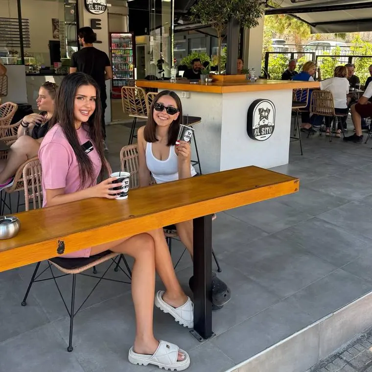 Customers at the long wooden bar
