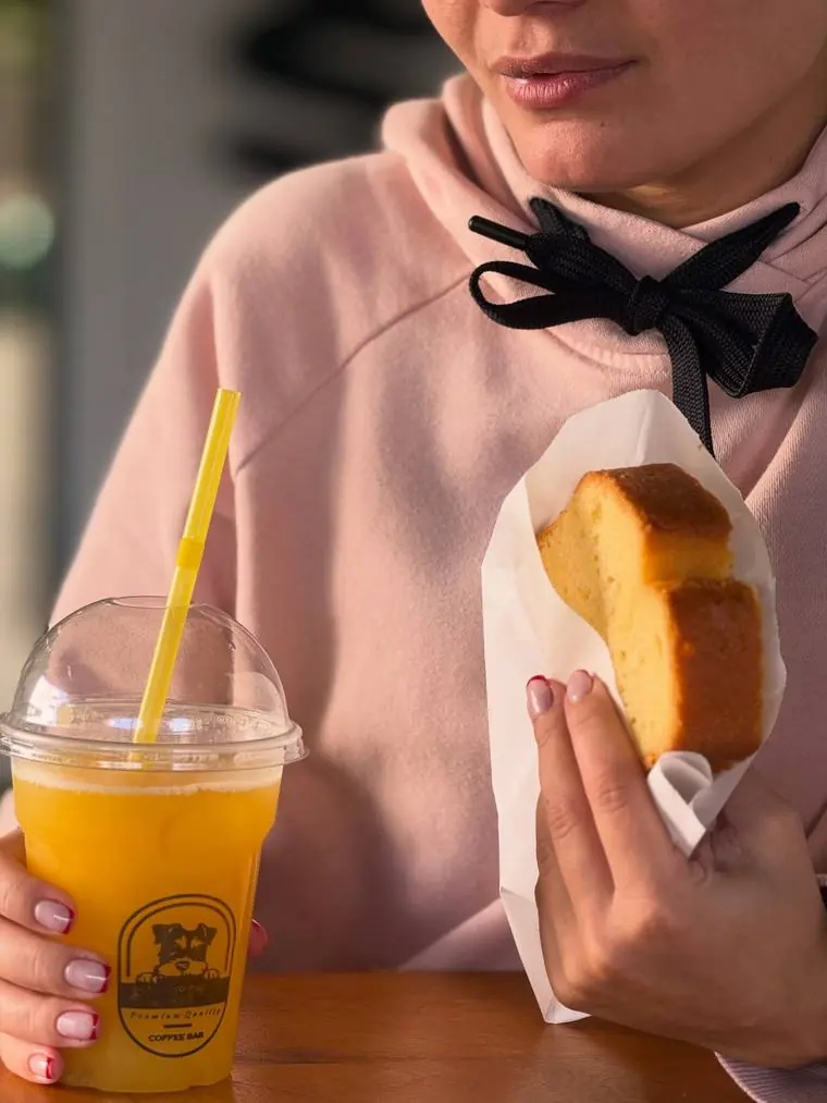 Fresh orange juice and a slice of cake